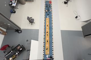 A view looking down at a long banner textile