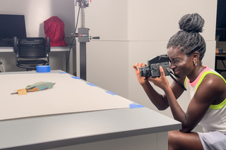 Elishevlyne Eliason, Yale College Class of 2025, photographs an ornithological specimen for an ongoing body of work